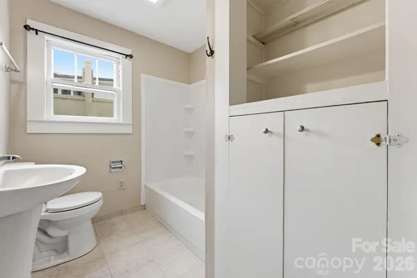 a bathroom with a toilet sink and a bathtub
