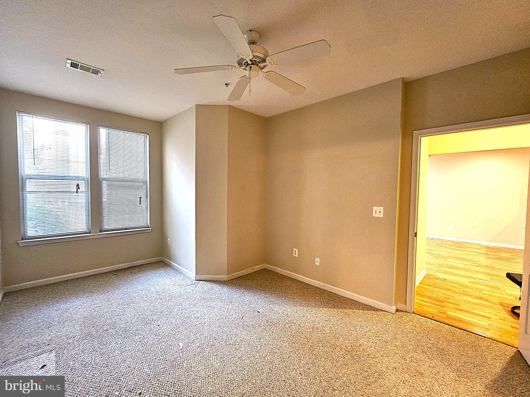 12000 Market Street, Unit 283 Reston, VA 20190 - Photo 21 of 36 a view of an empty room with a window