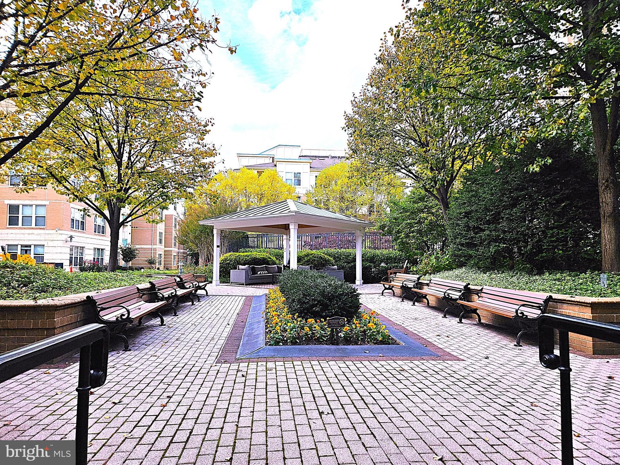 12000 Market Street, Unit 283 Reston, VA 20190 - Photo 34 of 36 a couple of benches sitting in front of building