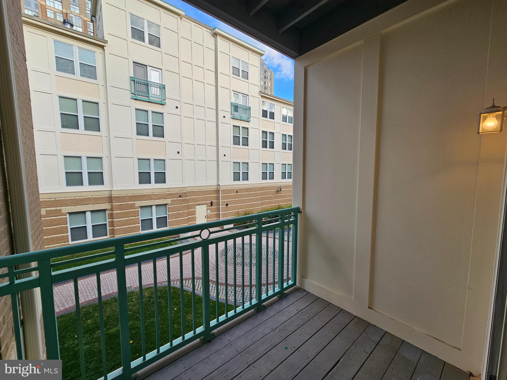 12000 Market Street, Unit 283 Reston, VA 20190 - Photo 8 of 36 a view of a balcony with wooden floor