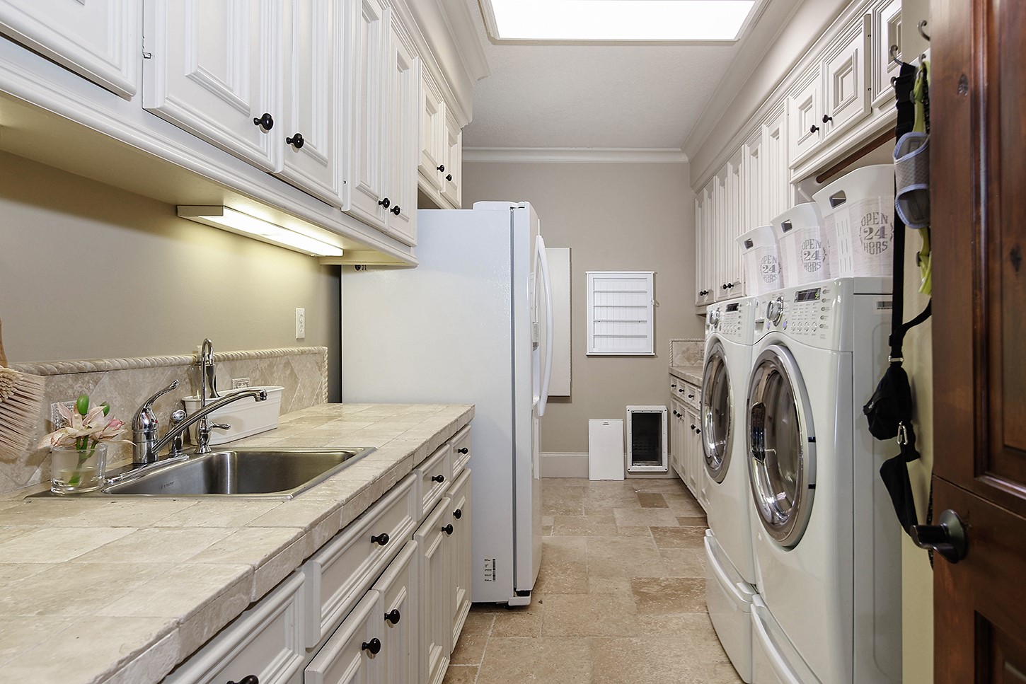 119 Angel Leaf Road The Woodlands, TX 77380 - Photo 18 of 50 a utility room with dryer and washer