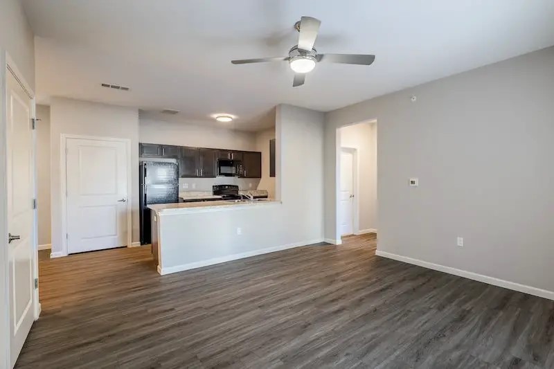 516 North Pierce Street Lafayette, LA 70501 - Photo 12 of 16 a view of kitchen with refrigerator microwave and wooden floor