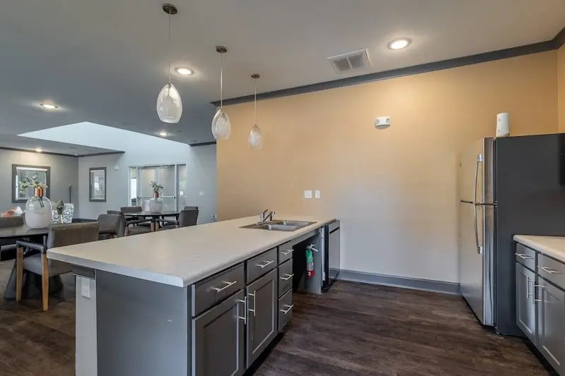 516 North Pierce Street Lafayette, LA 70501 - Photo 13 of 16 a kitchen with a sink a refrigerator a stove and cabinets