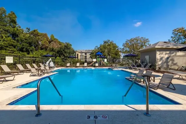 a view of a swimming pool with a patio