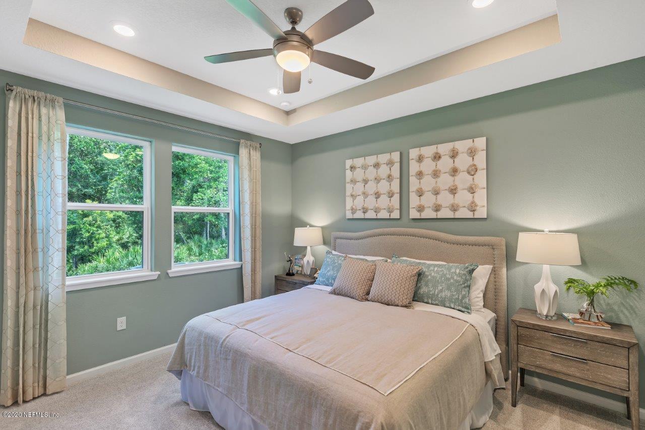 510 Modesto Drive St. Augustine, FL 32086 - Photo 13 of 38 a bedroom with a large bed and a window