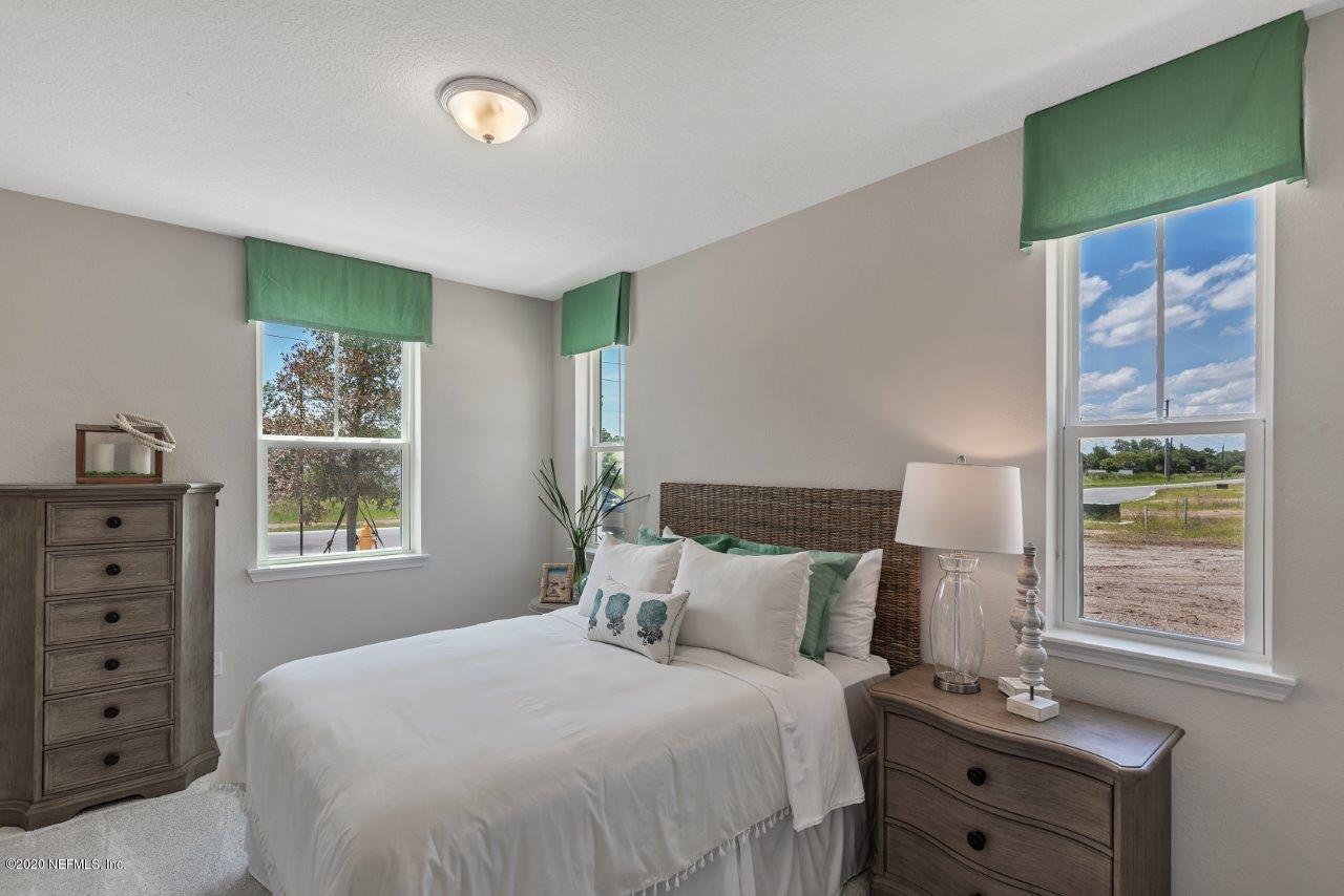 510 Modesto Drive St. Augustine, FL 32086 - Photo 18 of 38 a bedroom with a bed and a window