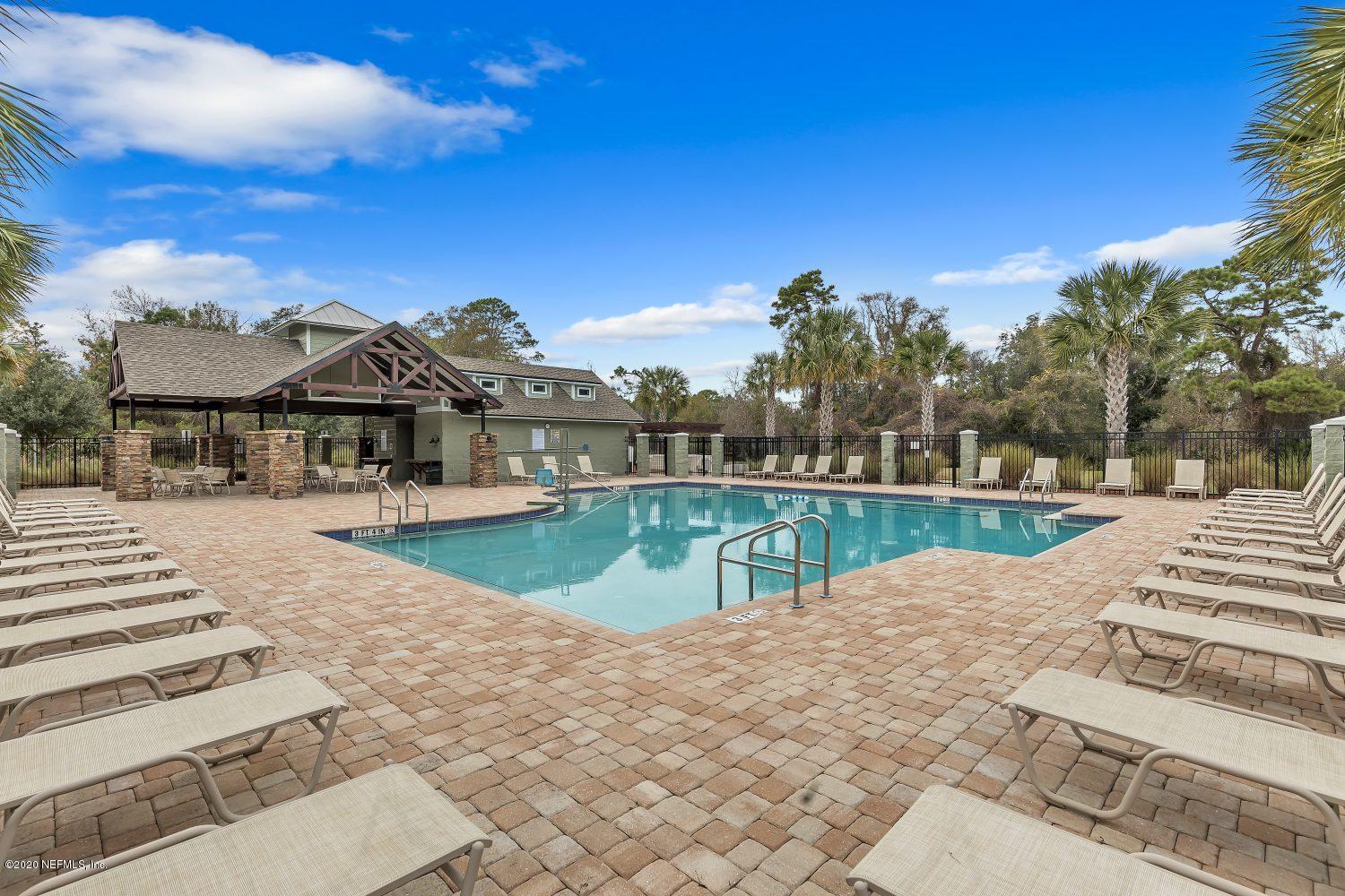 510 Modesto Drive St. Augustine, FL 32086 - Photo 26 of 38 a view of swimming pool with a yard
