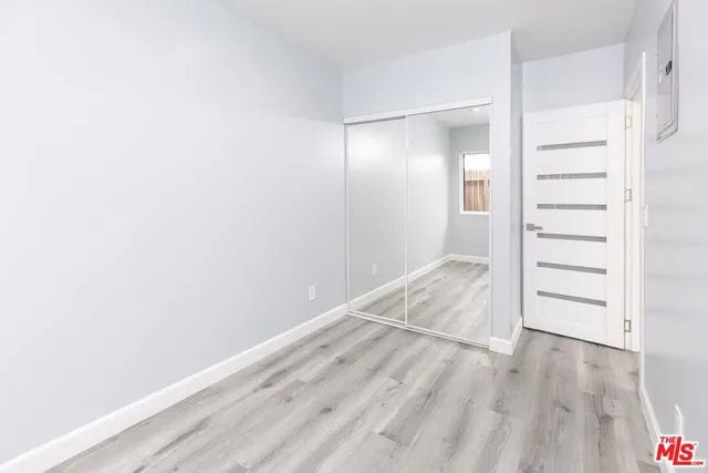 an empty room with wooden floor