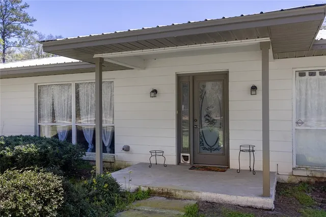 front view of a house with a bench