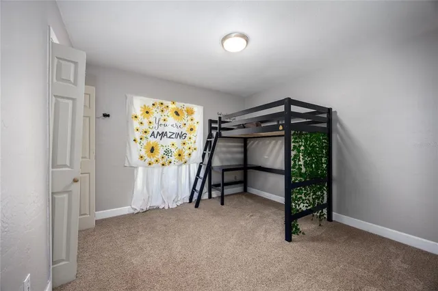 a view of a house with garden and sitting area