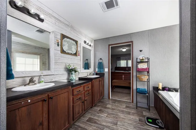 a dining table chair and refrigerator in a kitchen