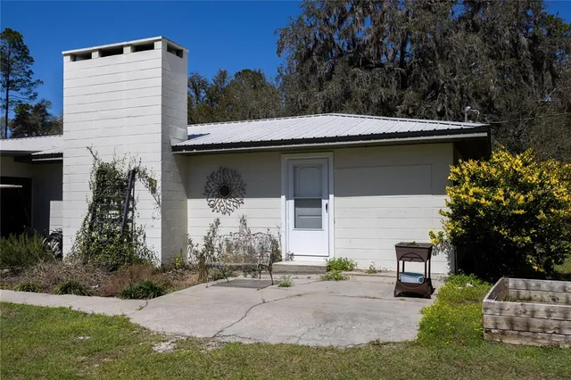 a kitchen with granite countertop white cabinets and appliances
