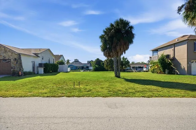 a view of a house with a garden and basketball court