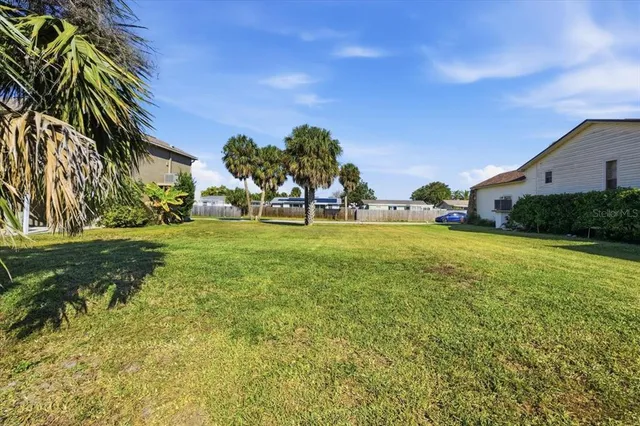 a backyard of a house with lots of green space