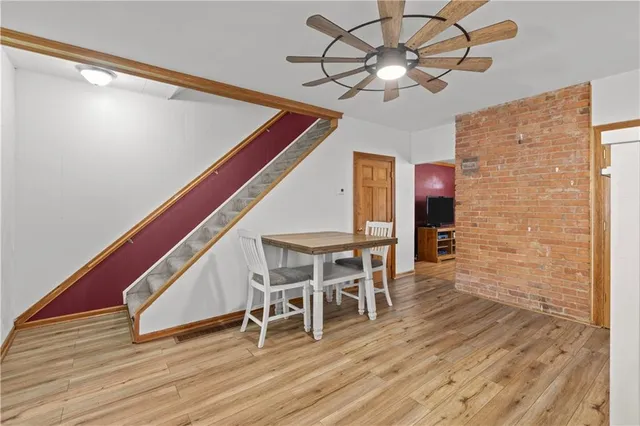 a view of a livingroom with furniture and wooden floor
