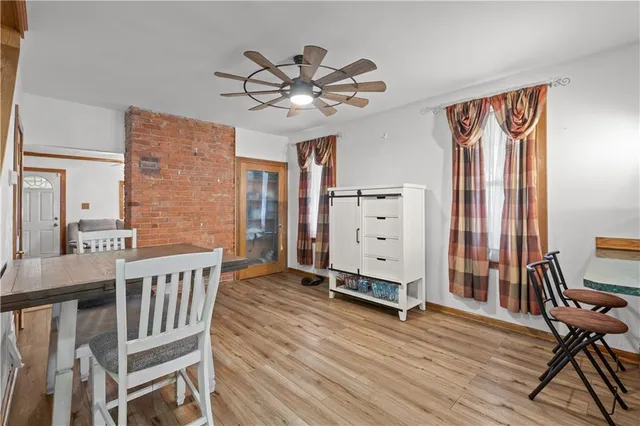 a view of a livingroom with furniture and wooden floor