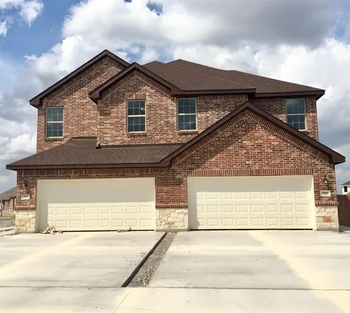 a front view of a house with a garage