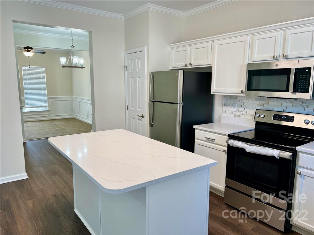 841 Dillard Road Rock Hill, SC 29730 - Photo 11 of 20 a kitchen with stainless steel appliances a refrigerator a stove a microwave and cabinets