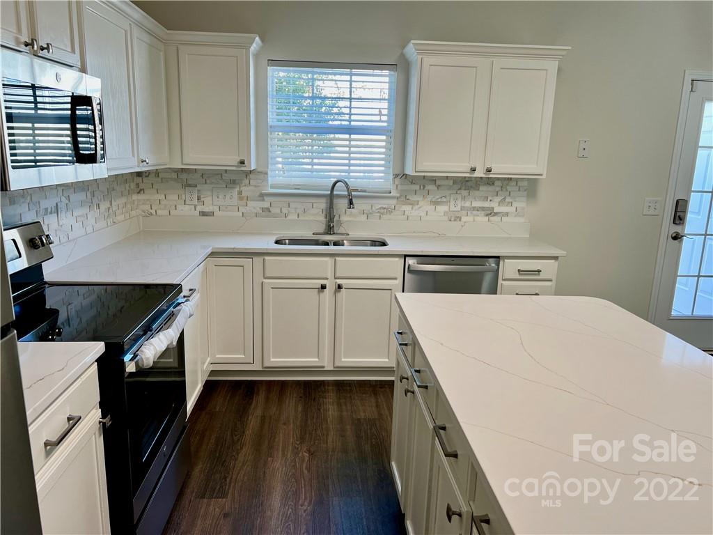 841 Dillard Road Rock Hill, SC 29730 - Photo 10 of 20 a kitchen with a sink stove and cabinets