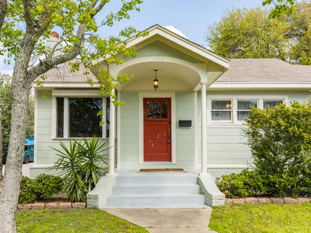4528 Avenue R 1/2 Galveston, TX 77551 - Photo 2 of 22 a front view of a house with garden