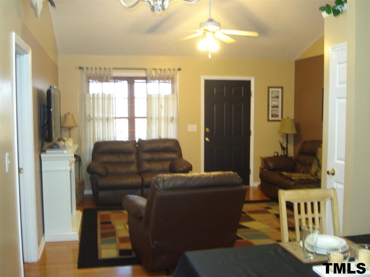 3755 Old Stage Road North Angier, NC 27501 - Photo 4 of 15 a living room with furniture a ceiling fan and a window