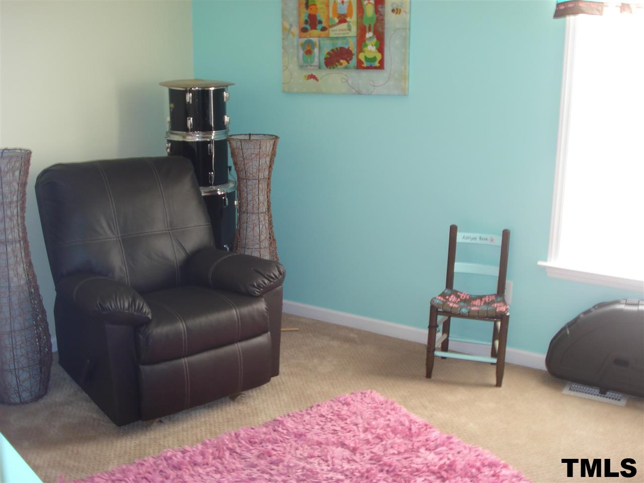 3755 Old Stage Road North Angier, NC 27501 - Photo 8 of 15 a living room with furniture and a chair