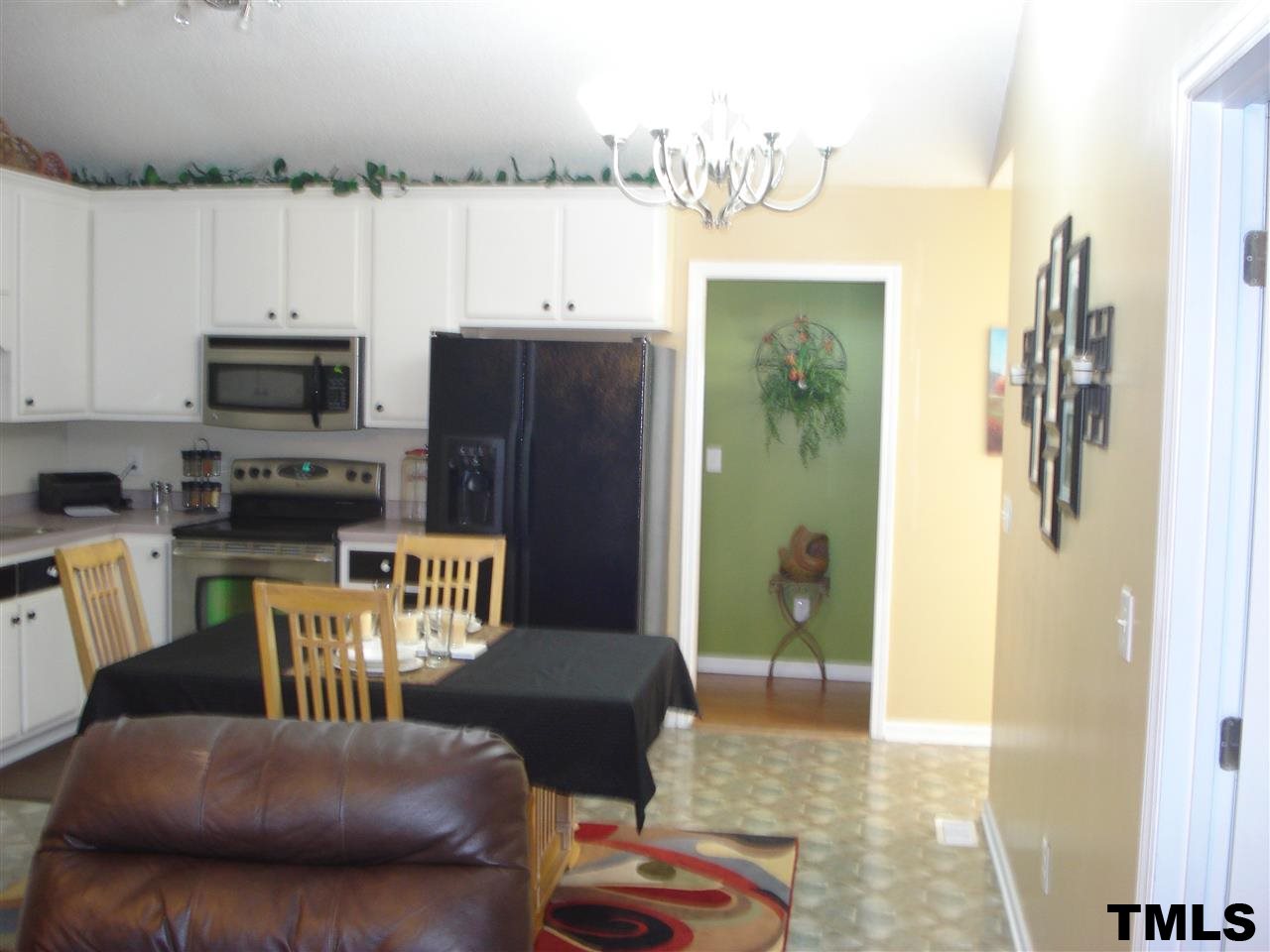 3755 Old Stage Road North Angier, NC 27501 - Photo 10 of 15 a kitchen with a refrigerator and a stove top oven
