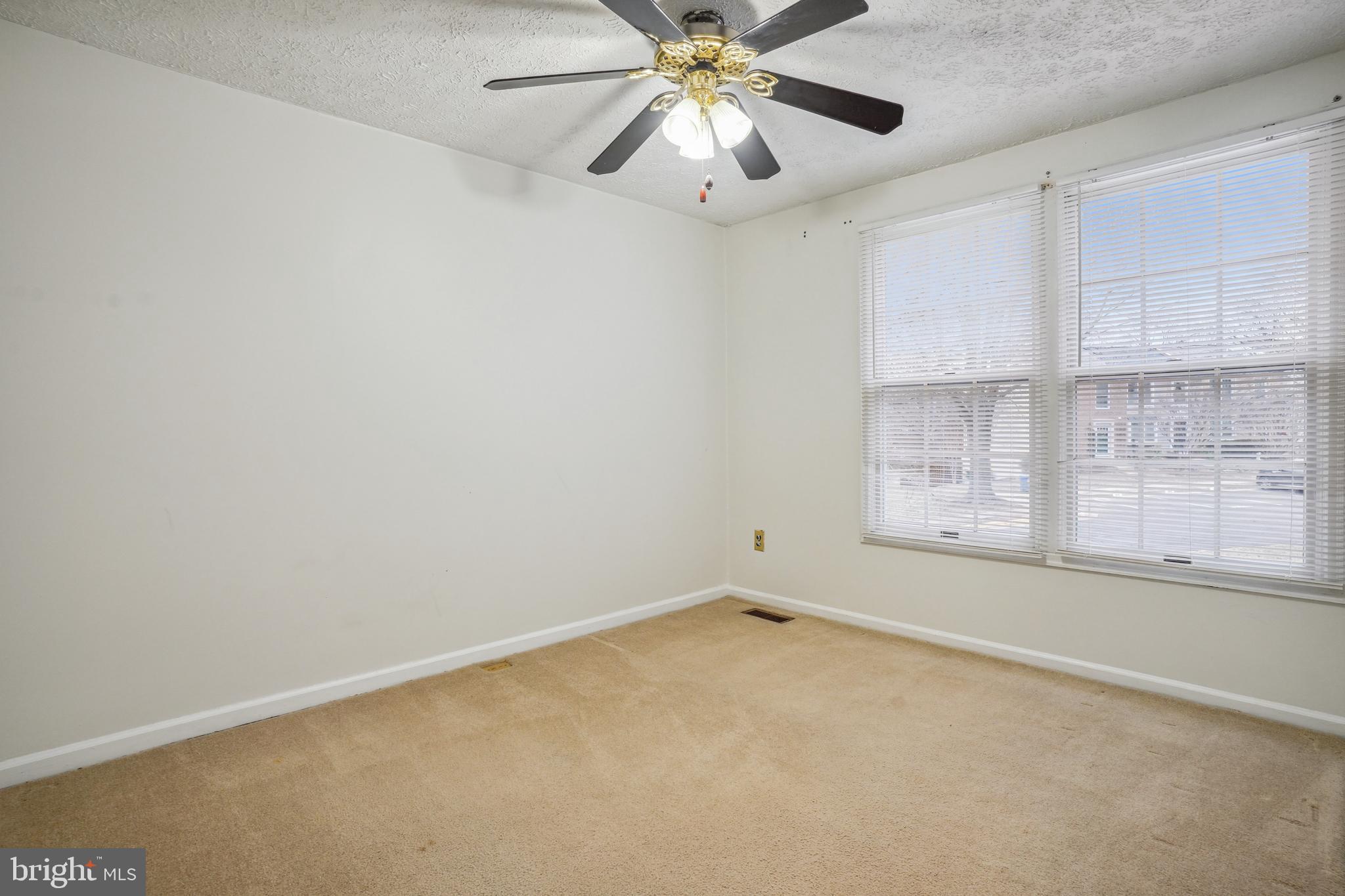 6377 Generals Court Centreville, VA 20121 - Photo 23 of 32 an empty room with windows and fan