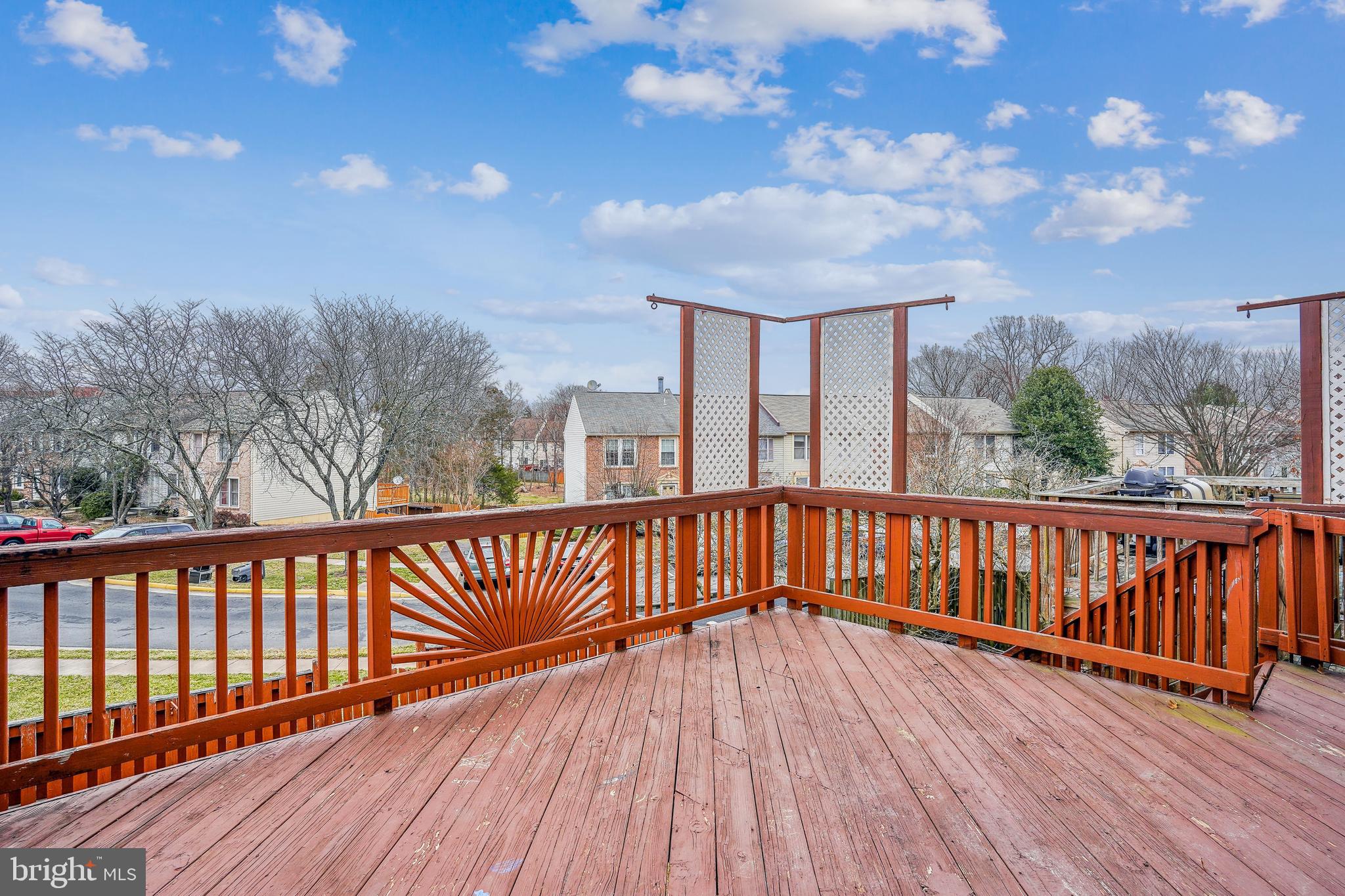 6377 Generals Court Centreville, VA 20121 - Photo 30 of 32 a view of balcony with wooden floor and fence