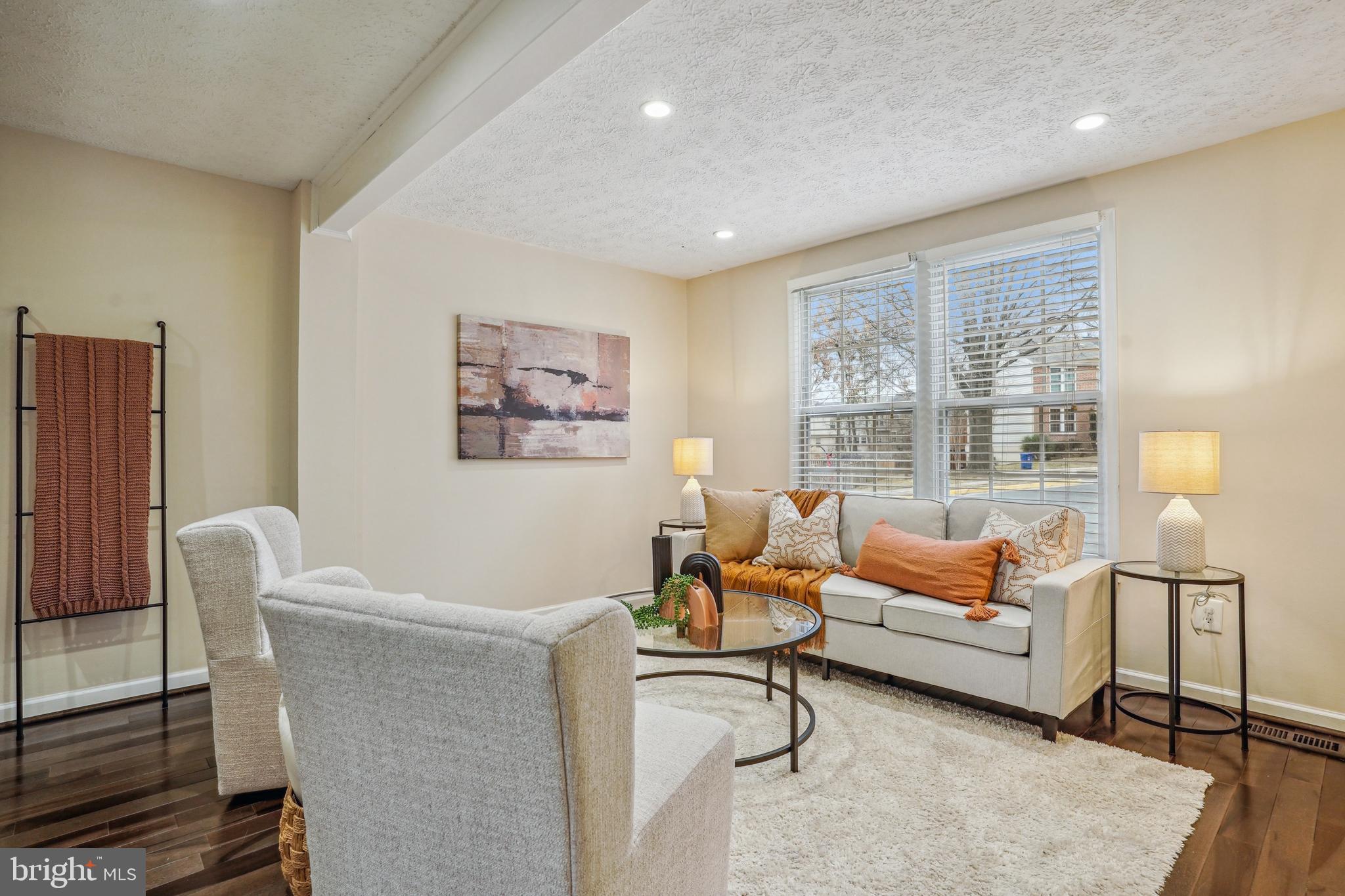 6377 Generals Court Centreville, VA 20121 - Photo 4 of 32 a living room with furniture and a window