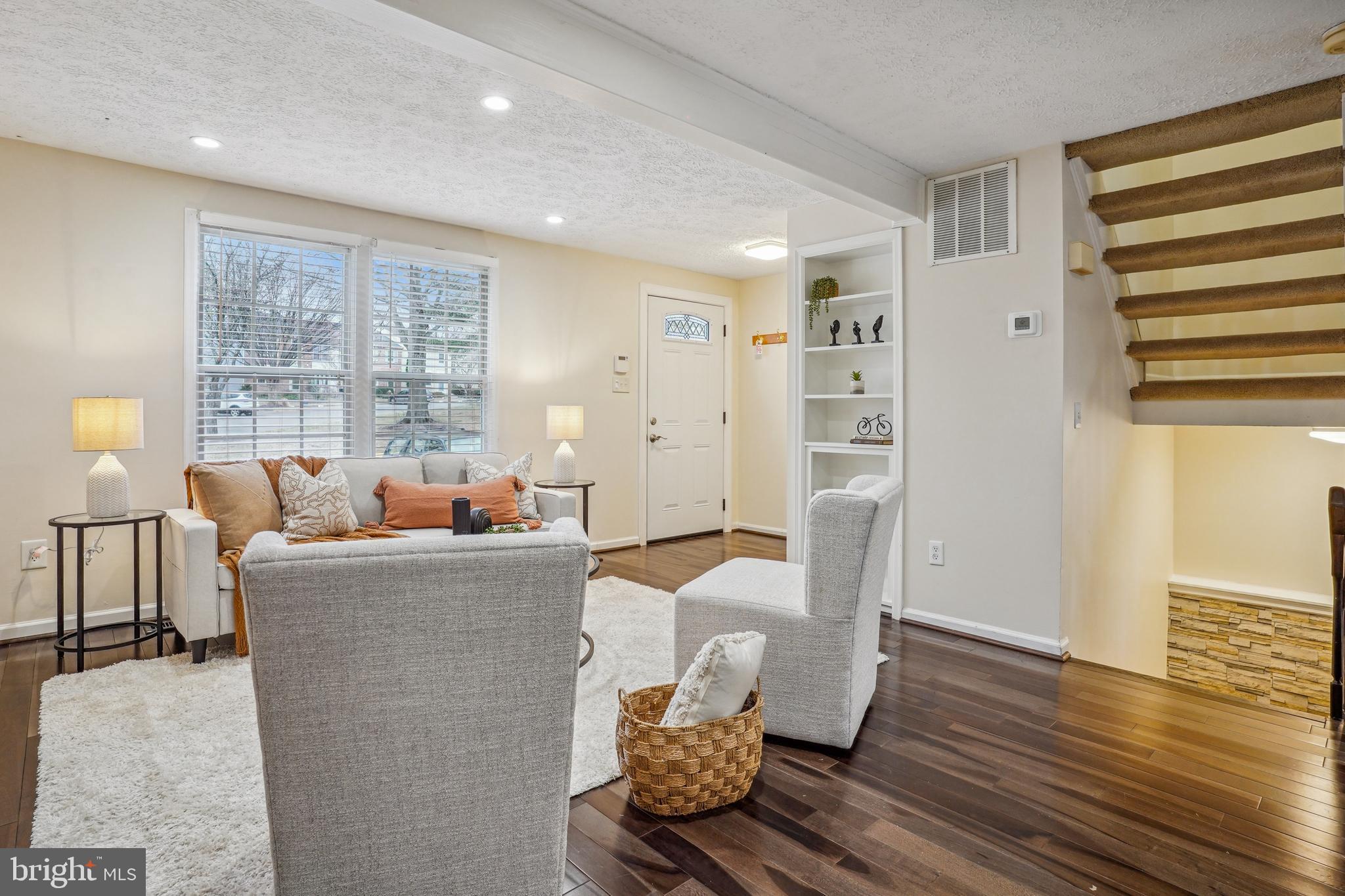 6377 Generals Court Centreville, VA 20121 - Photo 7 of 32 a living room with furniture and wooden floor