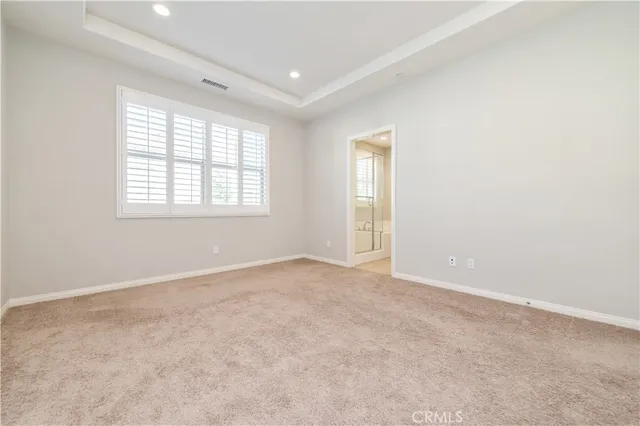 a spacious bathroom with a large tub shower and sink