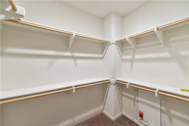 a view of an empty room with windows