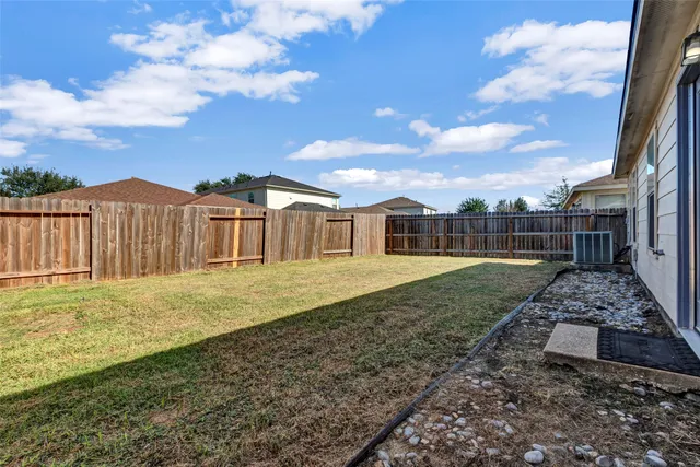 a view of a yard with a house