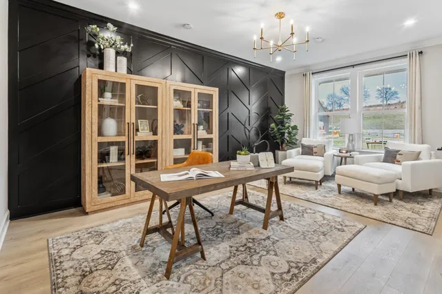 a living room with furniture window and wooden floor