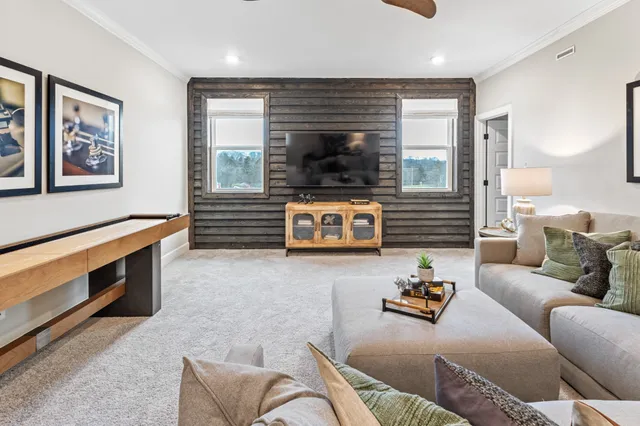 a living room with furniture and windows