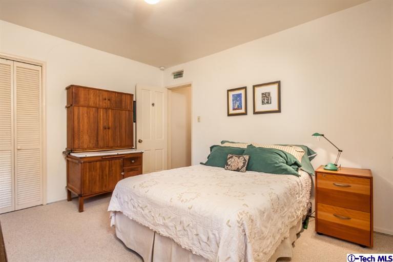 525 Lakeview Road Pasadena, CA 91105 - Photo 11 of 23 a bedroom with a bed and dresser