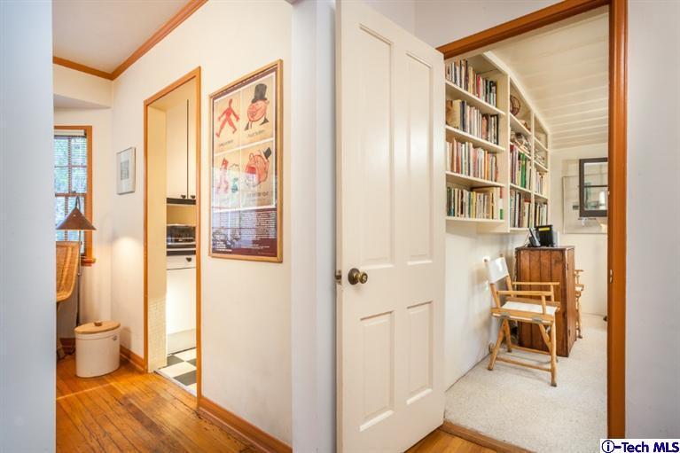 525 Lakeview Road Pasadena, CA 91105 - Photo 13 of 23 a view of a hallway with wooden floor and a living room
