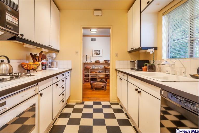 525 Lakeview Road Pasadena, CA 91105 - Photo 15 of 23 a kitchen with sink cabinets and window