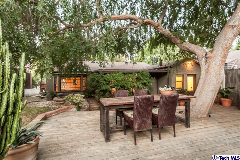525 Lakeview Road Pasadena, CA 91105 - Photo 19 of 23 a view of a patio with table and chairs with wooden floor and fence