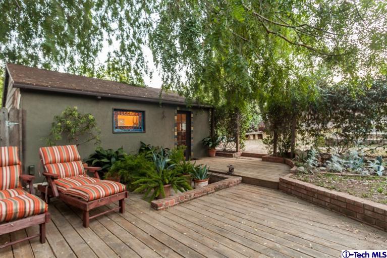 525 Lakeview Road Pasadena, CA 91105 - Photo 21 of 23 a view of a backyard with sitting area and furniture