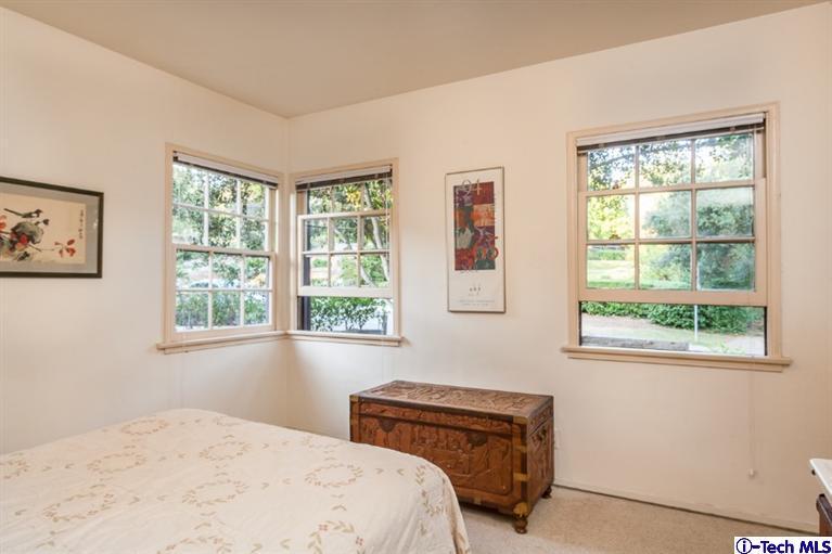525 Lakeview Road Pasadena, CA 91105 - Photo 10 of 23 a bedroom with a bed and a window