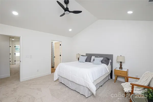 a bedroom with a bed and a chair