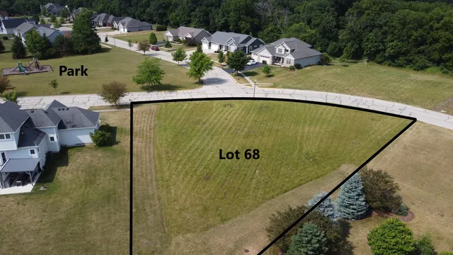 a view of a swimming pool with a yard