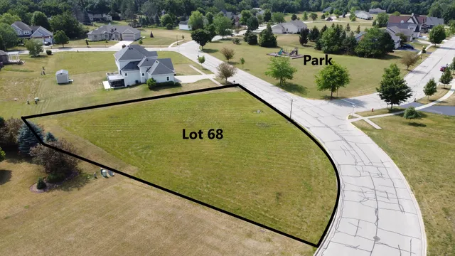 a view of a swimming pool with a yard