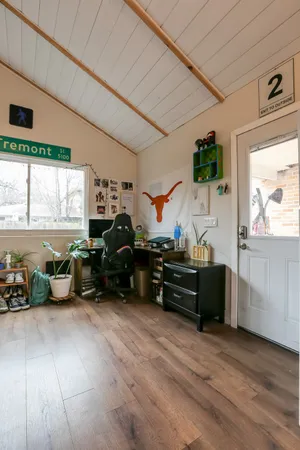 a living room with furniture window and flat screen tv