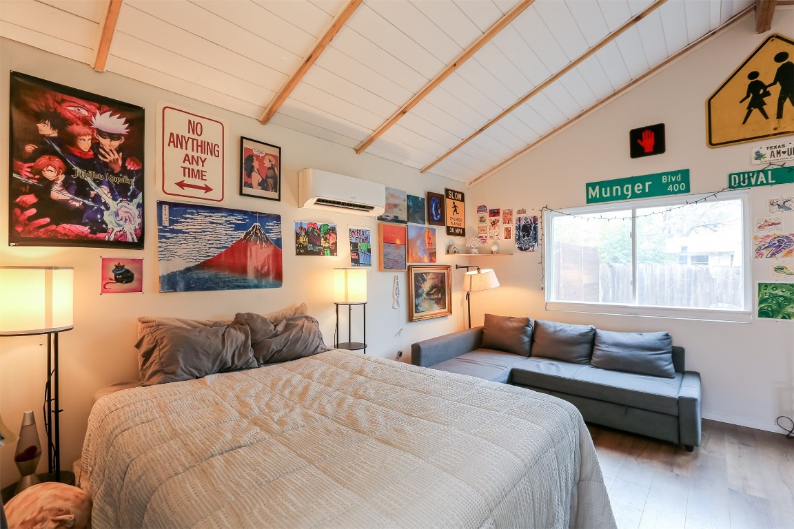 308 East 32nd Street, Unit B Austin, TX 78705 - Photo 17 of 27 a bedroom with a bed and a couch