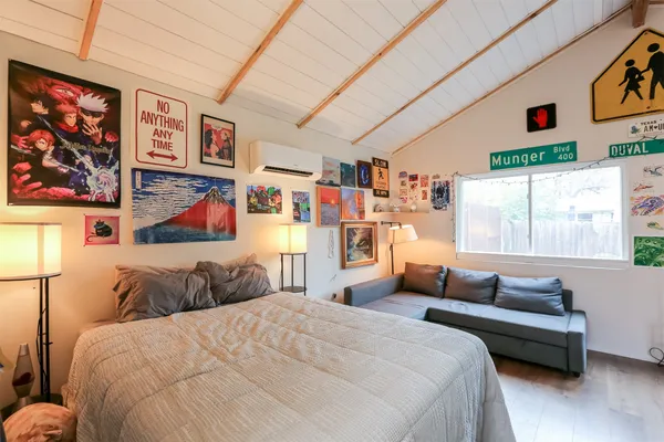 a bedroom with a bed and a couch