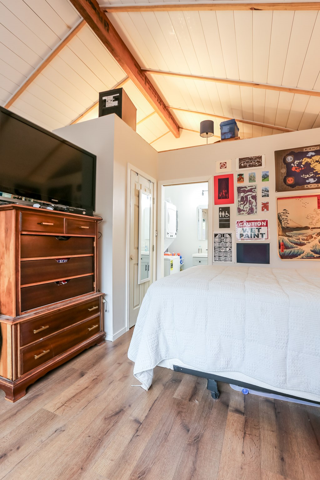 308 East 32nd Street, Unit B Austin, TX 78705 - Photo 19 of 27 a bedroom with furniture and a flat screen tv