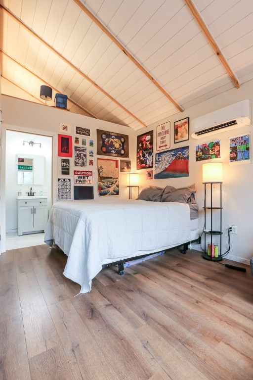 308 East 32nd Street, Unit B Austin, TX 78705 - Photo 20 of 27 a living room with furniture and a wooden floor